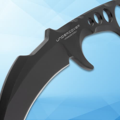 Close-up of black knife handle with finger holes