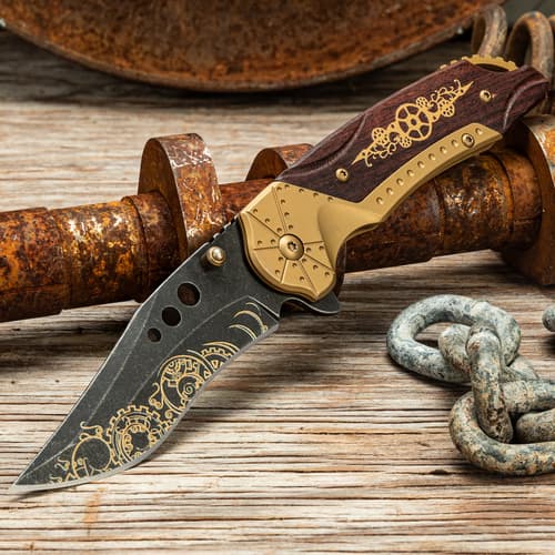 Steampunk knife with intricate design on rustic wooden surface