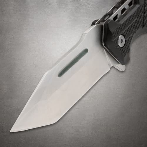 Close-up of a knife blade with a textured handle