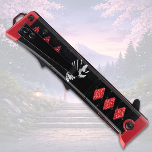 Closed knife with red accents and design