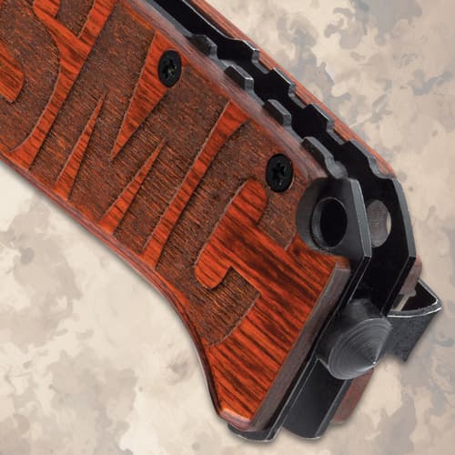 Close-up of USMC engraved wooden knife handle