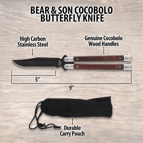 Butterfly knife with dimensions and carry pouch on wood background
