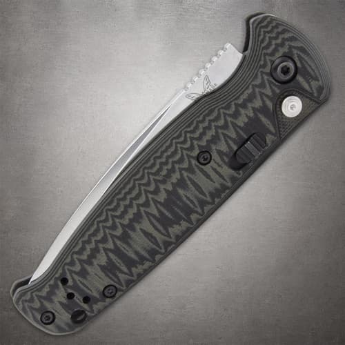 Closed Benchmade knife with textured handle and button