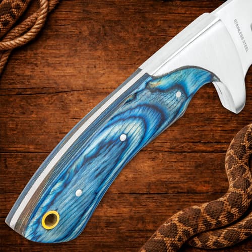 Close-up of blue pakkawood knife handle