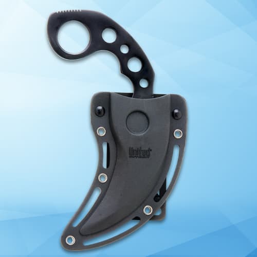 Karambit knife partially sheathed on blue background