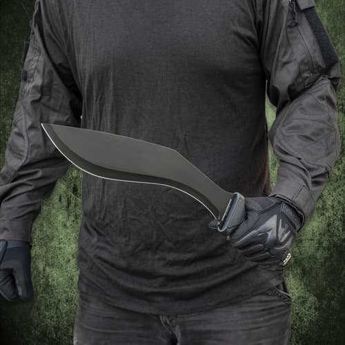 Person in tactical gear holding a black sword