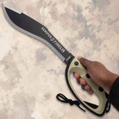 Hand holding USMC kukri knife with serrated blade
