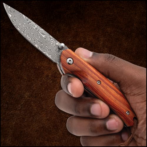 Timber Wolf Damascus Knife in hand