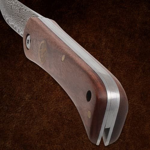 Close-up of wooden handle on a folding knife