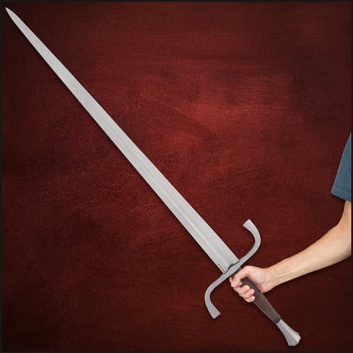 Angled view of the black leather wrapped handle with circular pommel and decorative guard accent.