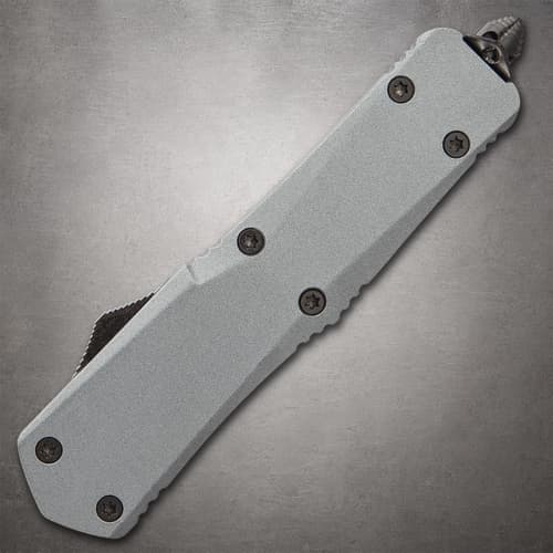 Closed tactical knife showing screws and metal tip