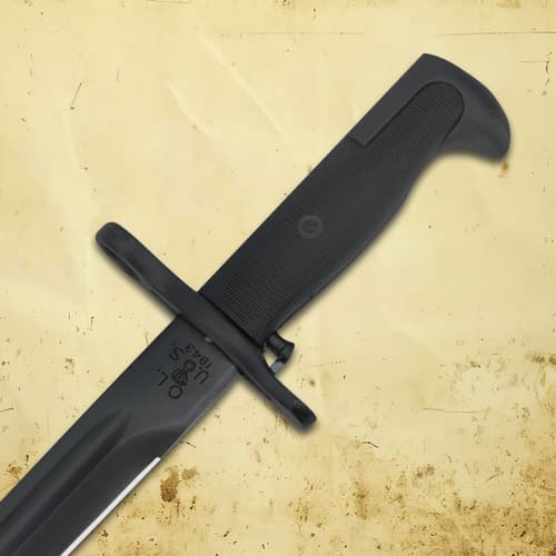 Close-up of bayonet handle on a textured background