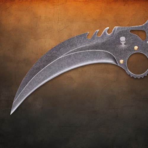 Close-up of stonewashed blade with skull engraving