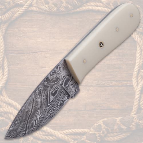 Knife with cream handle and patterned blade