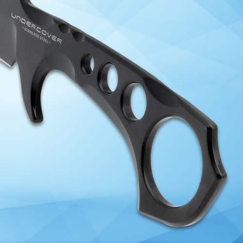 Close-up of knife handle with circular grip holes