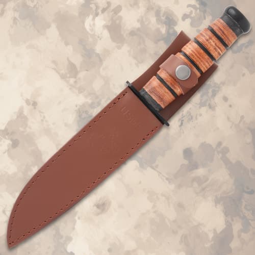 USMC knife in brown leather sheath with button closure