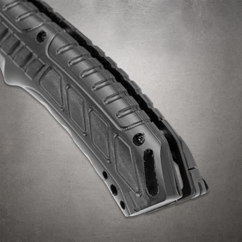 Close-up of the Black Legion knife's grooved black handle, rear opening, screws and pocket clip edge