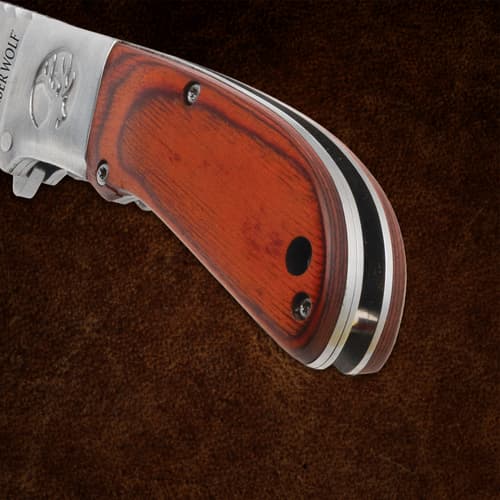 Close-up of Timber Wolf knife handle with wood texture