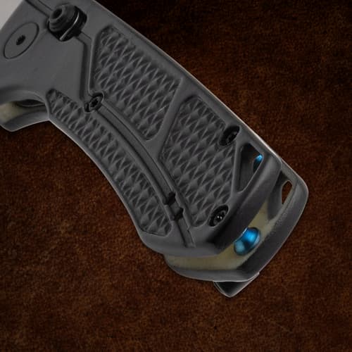 Close-up of the textured black handle of a folding knife