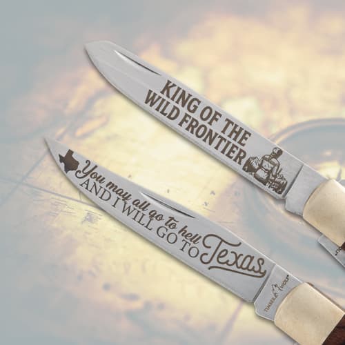 Close-up of two engraved knife blades