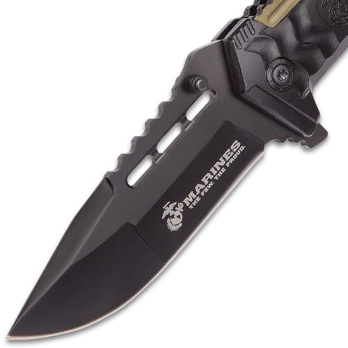 Close-up of black tactical knife blade with logo