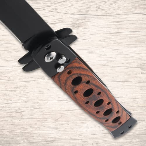 Close-up of stiletto knife handle with wood inlay