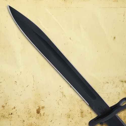 Close-up of black bayonet blade on a textured background