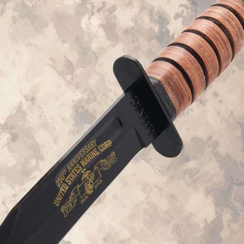 Close-up of USMC knife handle and blade inscription