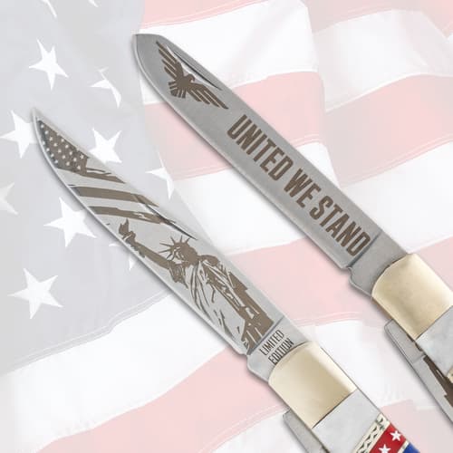 Close-up of knife blades with 'United We Stand' and patriotic engravings