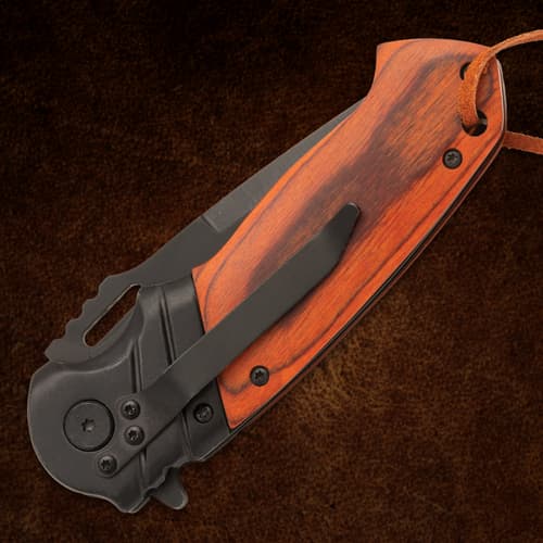 Folded Timber Wolf knife showing pocket clip and wood handle