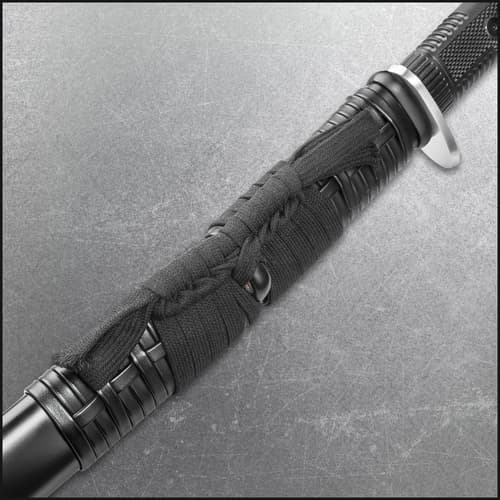 Close view of honshu katana sword encased in black leather sageo