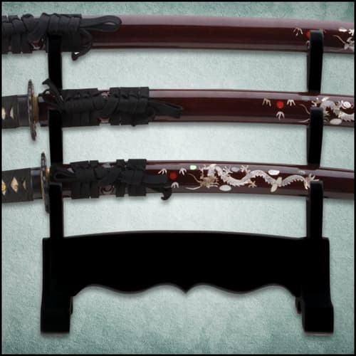 The three sword scabbards are maroon with natural pearl dragon design on the side.