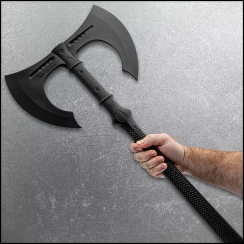 A hand holding the training axe.