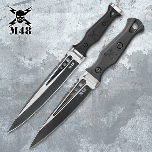 Two M48 tactical knives with black handles on a textured background
