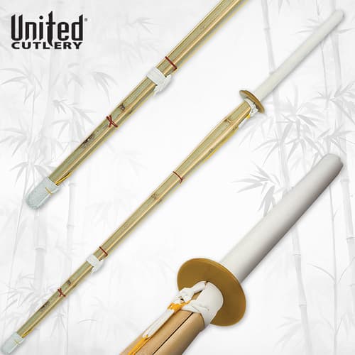Bamboo shinai sword with white handle and guard on bamboo background