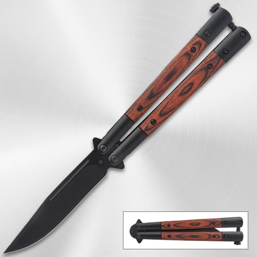 Butterfly knife with wood handle on metallic background