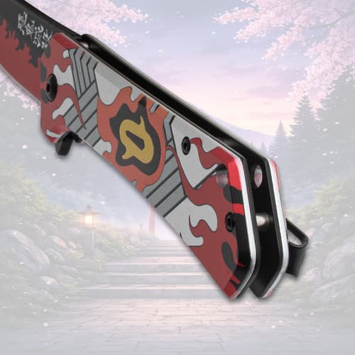 Close-up of knife handle with flame pattern, scenic backdrop