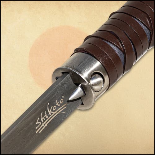 Close up image of the button that pushes the blade out on the Damascus Gentleman's Hook Sword Cane.