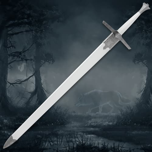 Silver sword with detailed hilt, wolf silhouette in misty forest
