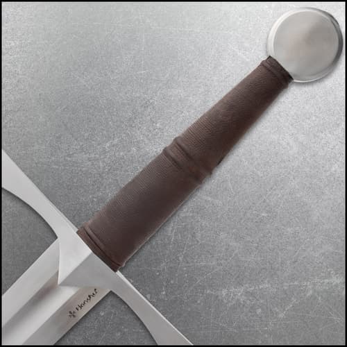 Close-up of sword handle with brown grip and round pommel