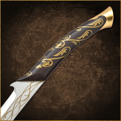 Close-up of sword handle with gold vine design