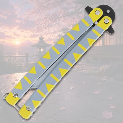 Closed butterfly knife with yellow and gray design