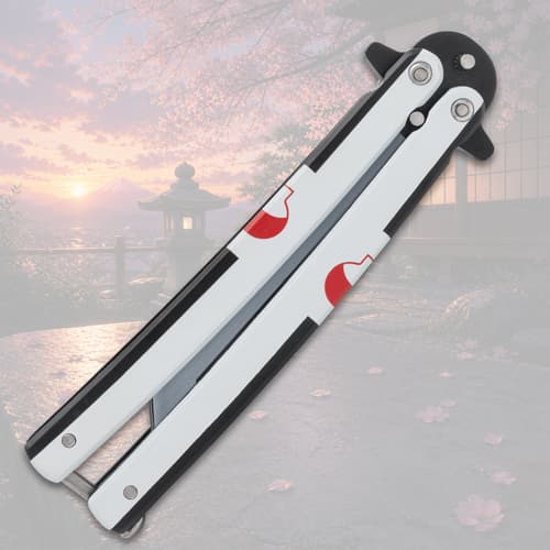 Closed butterfly knife with red design on handle
