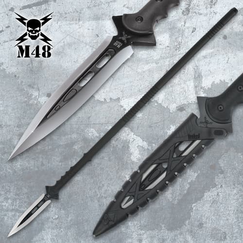 Close-up of black spear with silver blade and sheath
