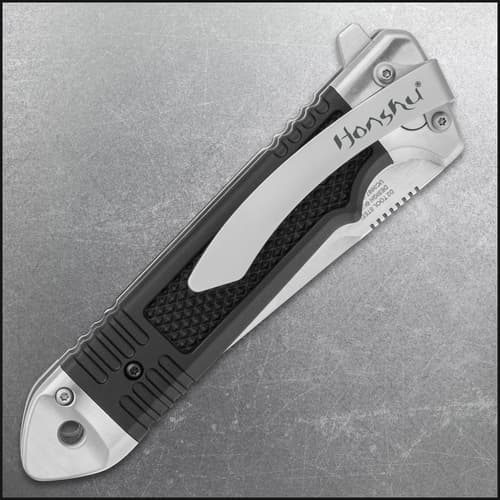 Folded Honshu knife showing pocket clip and handle design