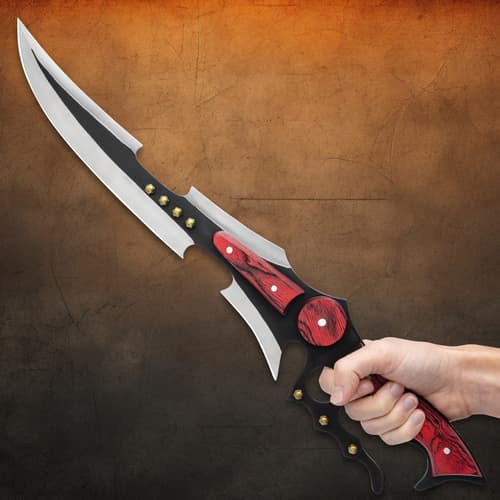 Hand holding a fantasy sword with red accents