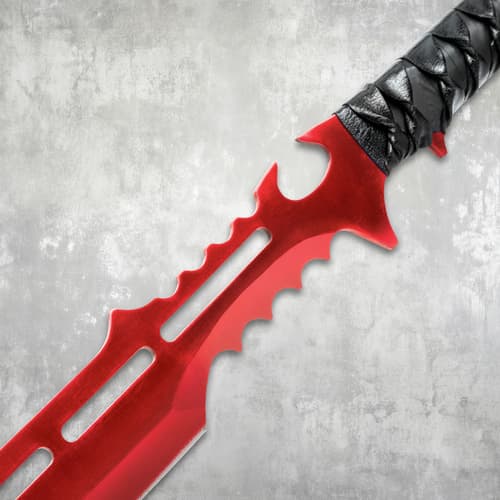 Close-up of red sword blade and black wrapped handle