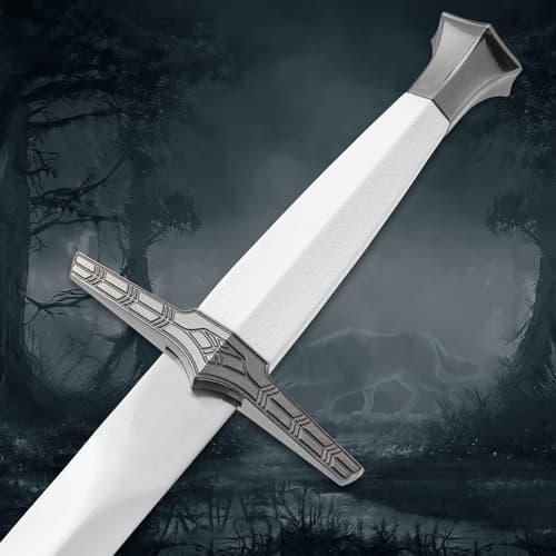 Close-up of sword hilt and handle, wolf silhouette