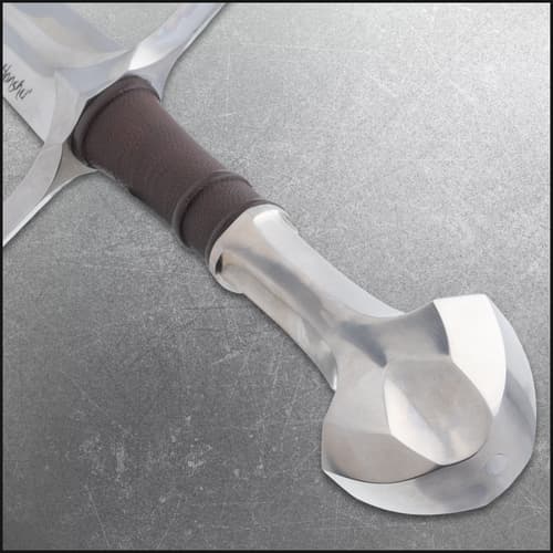 Close-up of sword pommel and leather-wrapped grip