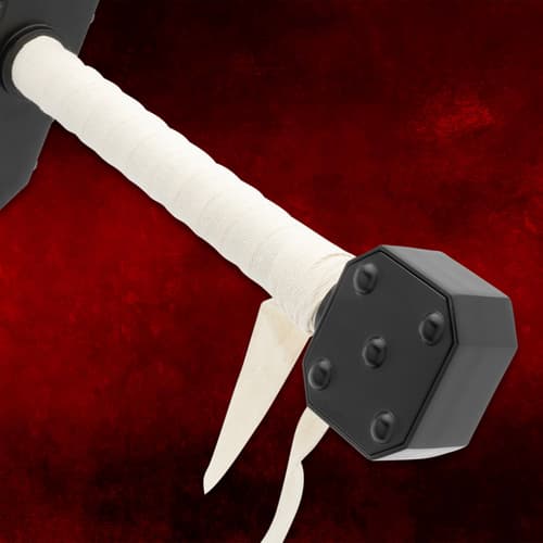 Close-up of sword handle wrapped in white linen